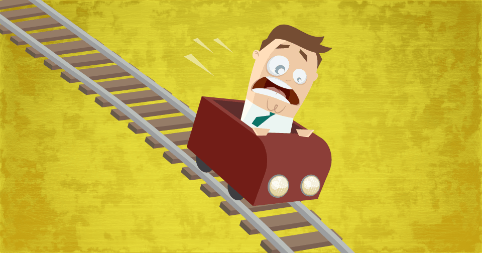 ジェットコースターに乗っている怖がるビジネスマンの画像